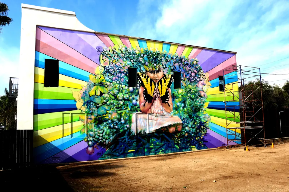 Rainbow mural with a tiger among flowers