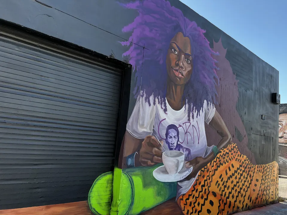 Mural of a woman with purple hair