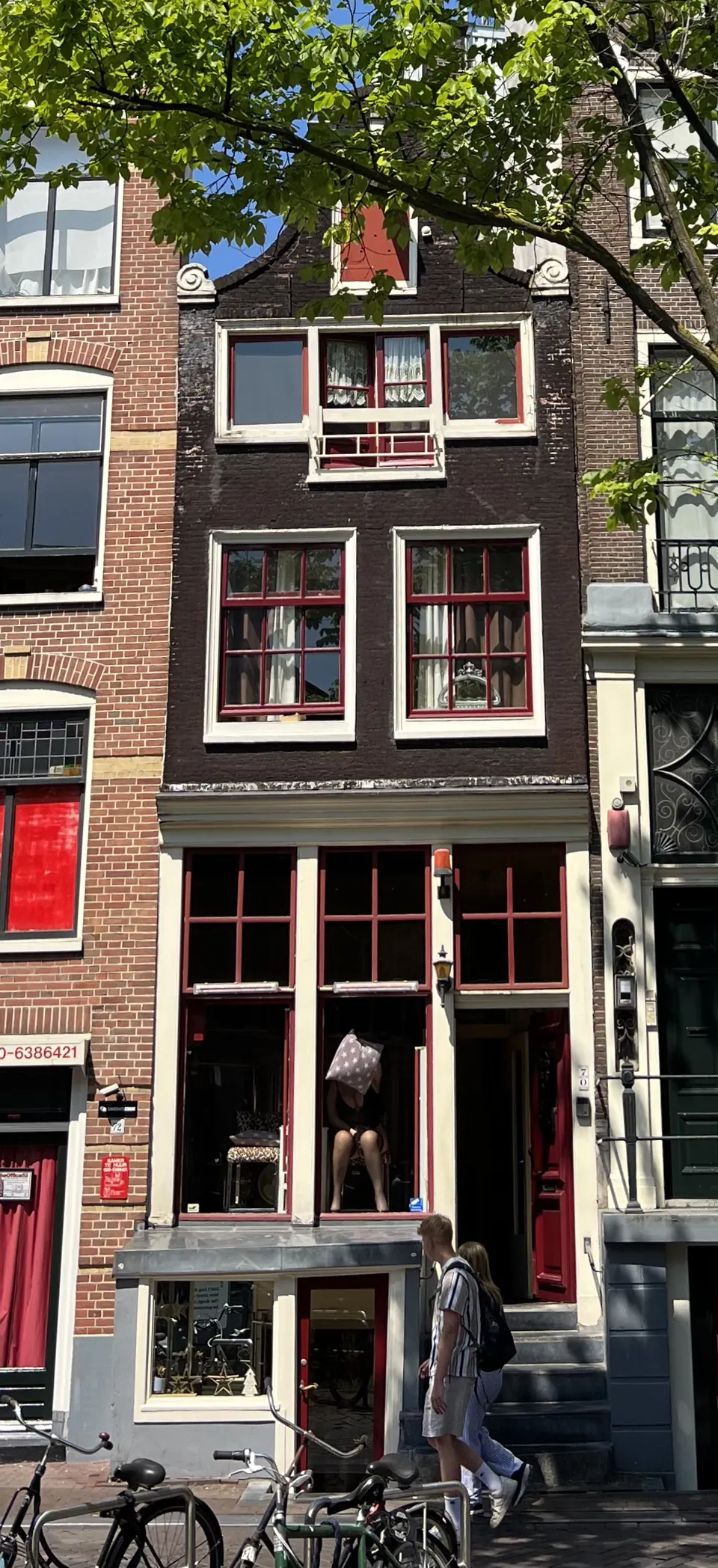 A narrow brick canal house